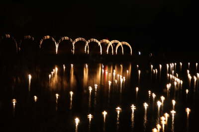 Lights floating in the pond at night in Alley Park